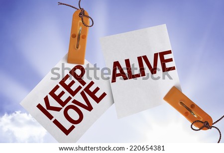 Keep Love Alive on Paper Note on sky background