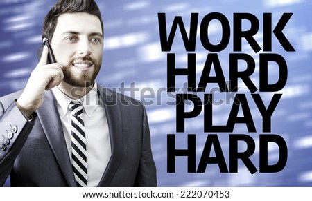 Business man with the text Work Hard Play Hard in a concept image