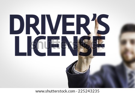 Business man pointing to transparent board with text: Drivers License