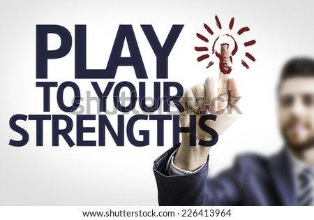 Business man pointing to transparent board with text: Play to Your Strengths