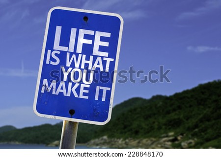 Life is What You Make It sign with a beach on background