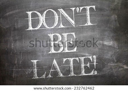 Don\'t Be Late written on blackboard