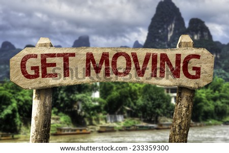Get Moving sign with a forest background