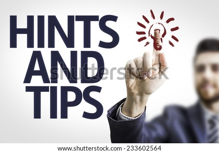 Business man pointing to transparent board with text: Hints and Tips