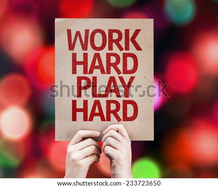 Work Hard Play Hard written on colorful background with defocused lights