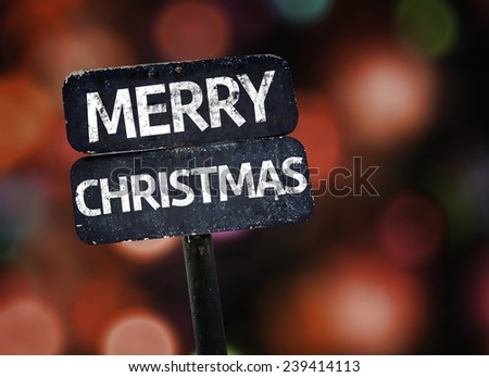 Merry Christmas sign with colorful background with defocused lights