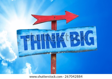 Think Big sign with sky background