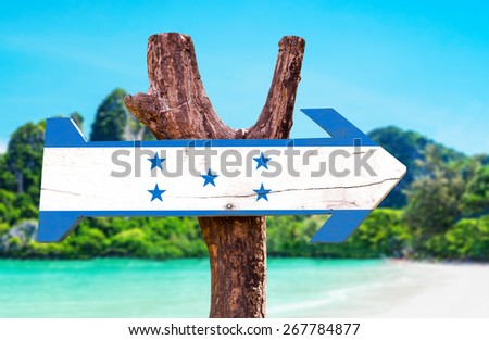 Honduras Flag wooden sign with beach background