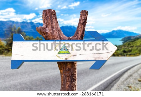 Nicaragua Flag wooden sign with road background