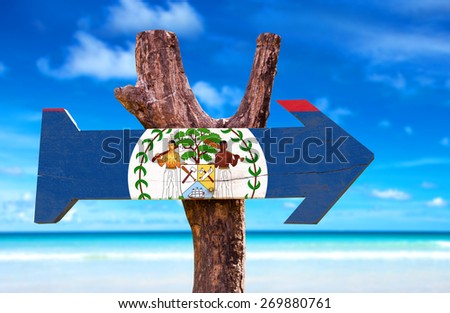 Belize Flag wooden sign with beach background