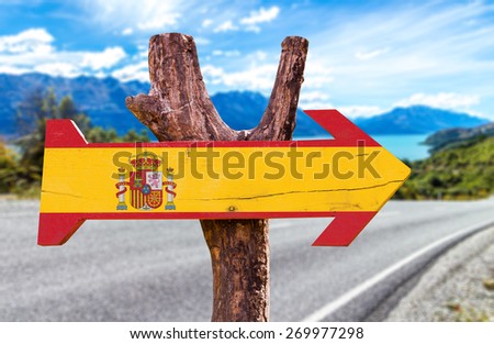 Spain Flag wooden sign with road background