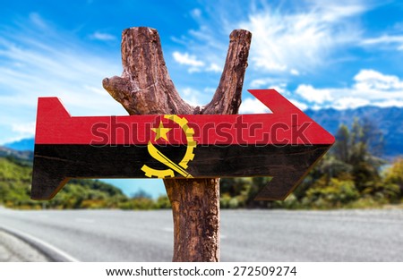Angola Flag wooden sign with road background