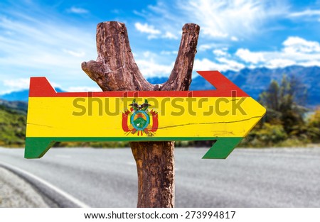 Bolivia Flag wooden sign with road background