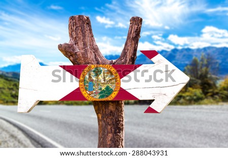 Florida Flag wooden sign with road background
