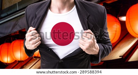 Businessman stretching suit with Japanese Flag with red lamp on background