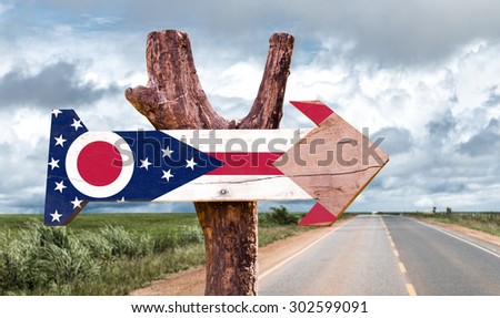 Ohio Flag wooden sign with agriculture landscape on background