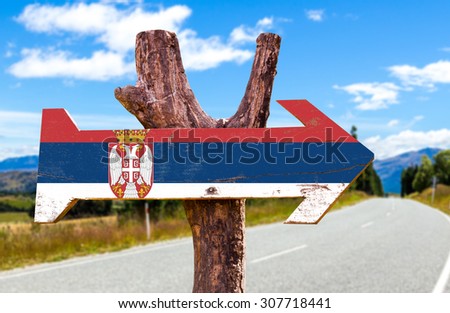 Serbia Flag wooden sign with road background