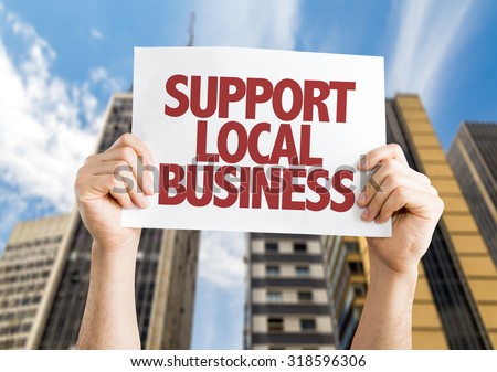 Support Local Business placard with skyscrappers background