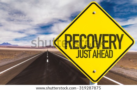 Recovery Just Ahead sign on desert road