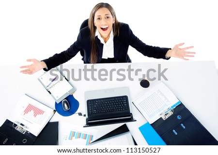overwhelmed businesswoman is stressed and overworked at her desk office job
