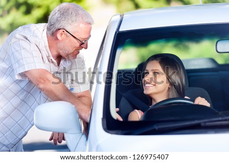 driving instructor teaching student learner driver
