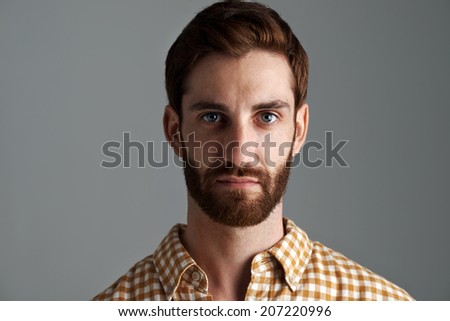 Portrait of young hipster man with ginger hair and beard