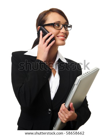 Young successful career woman holds her laptop and talks on her mobile phone