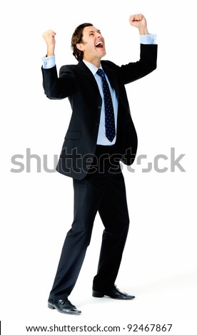 Excited businessman pumps both fists in the air in a celebratory gesture
