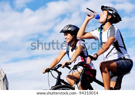 Cyclist drinking water to ensure hydration and to quench thirst.