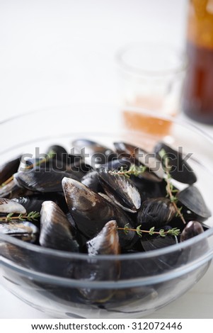 Fresh raw west coast mussels in a bowl ready for cooking