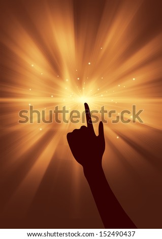 The background of the golden light beam, a hand stretched out finger, pointing to the shining point.