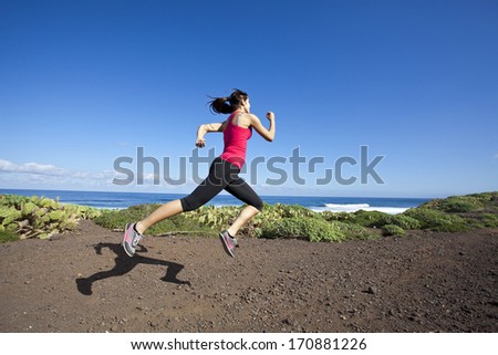 athlete woman running in nature. Healthy active lifestyle young woman exercising outdoors.