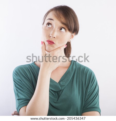 young beautiful woman  thinking, pensive face expression