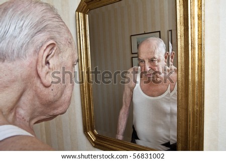 elder pensive at the mirror
