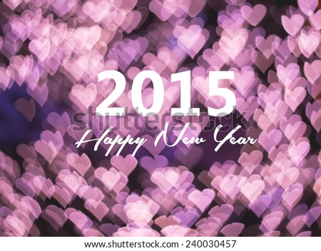Happy new year card, pink heart bokeh background