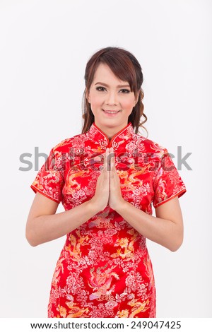 Asian Chinese girl greeting in Traditional Chinese, Welcome, Guest, put the palms of the hands together in salute. thai, chinese new year