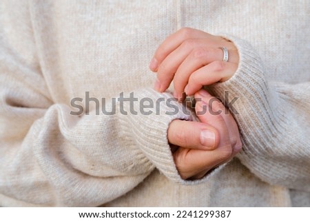 Similar – Image, Stock Photo female hands in winter gloves in a red and white striped hugging behind green Christmas tree outdoors. Christmas and New Year holiday concept