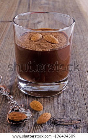 chocolate mousse, which is in a glass transparent glass