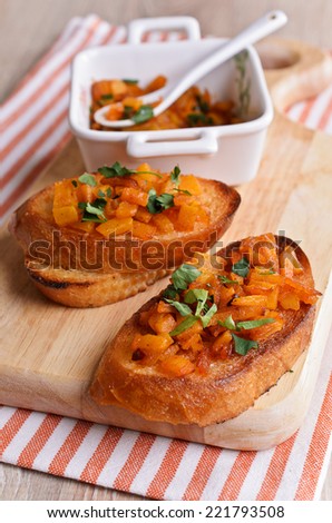Cooked with finely chopped pieces of pumpkin are on toasted bread