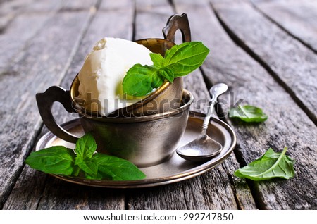 Ice cream white with mint leaves in metal ware