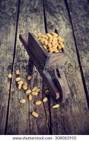 Pine nuts peeled on wood furniture in rustic style