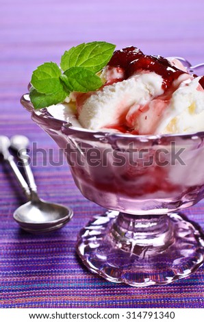 White ice cream with jam and mint. Selective focus