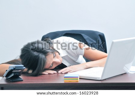 Sleeping girl at the office desk (landscape orientation)