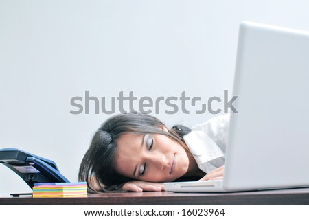 Sleeping girl on the office desk