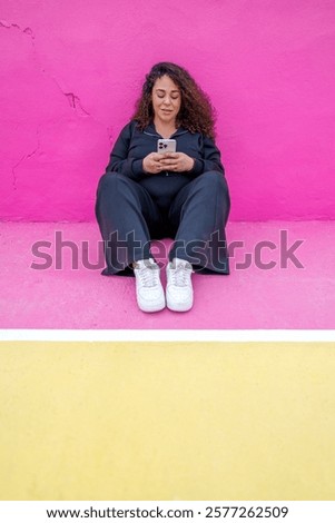 Similar – Foto Bild Friedliche Frau, die auf der Promenade bei Sonnenuntergang auf ihrem Smartphone surft