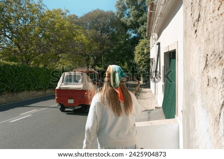 Similar – Image, Stock Photo Young long hair motorbike guy checking his phone while sitting on his old school motorbike during a break from the road route. Liberty life, young man heavy metal, white tshirt and gloves.