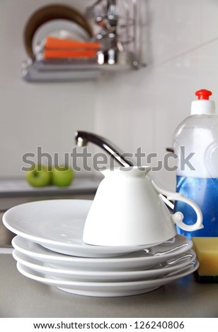 clean dish-ware, detergent and sponge