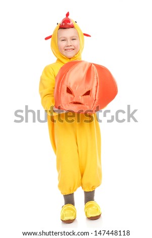 Boy in the chicken costume with Halloween pumpkin