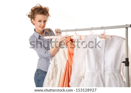 Young beautiful woman is choosing wedding dress