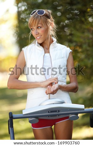 Woman running on the treadmill outdoors  Strange situation-ideal for commercial.